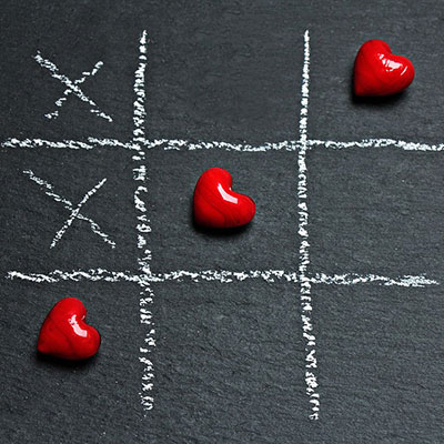 Tic Tac Toe game with winning row of hearts